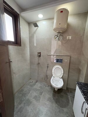 Bathroom in 2.5 BHK Builder Floor at Freedom Fighters Enclave – for Rent