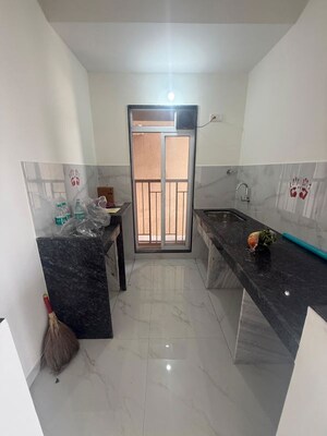 Kitchen in 1 BHK Apartment at Metropolis Bayside, Kasarvadavali – for Rent