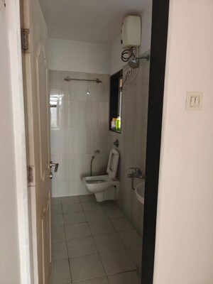 Bathroom in 2 BHK Apartment at Puranik City, Kasarvadavali – for Rent