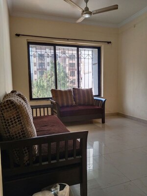 Living Room in 1 BHK Apartment at Ami Vini Solitaire, Dahisar West – for Rent