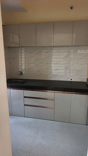 Kitchen in 2 BHK Apartment at Ram Pushpanjali Residency, Owale – for Rent