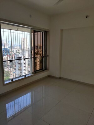Room in 2 BHK Apartment at Omkar Signet, Malad East – for Rent