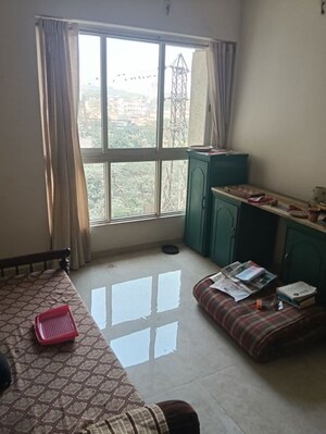 Living Room in 1 BHK Apartment at Lodha Amara, Kolshet Road – for Rent