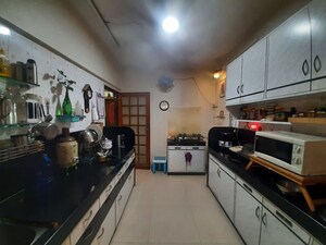 Kitchen in 3 BHK Apartment at Gokuldham Colony – for Sale