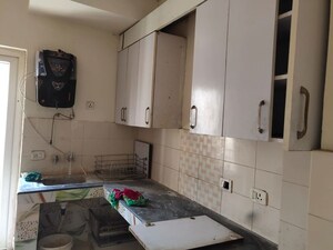 Kitchen in 2 BHK Apartment at Nimbus Express Park View, Chi V Greater Noida – for Rent