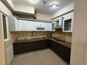 Kitchen in 3 BHK Apartment at Mahagun Moderne, Sector 78 – for Rent