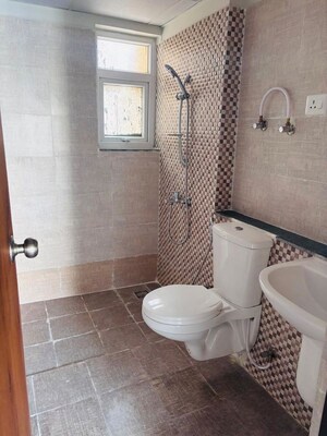 Bathroom in 3 BHK Apartment at Shri Radha Sky Gardens, Sector 16b Greater Noida – for Rent