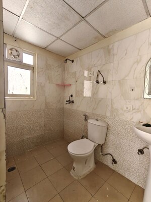 Bathroom in 3 BHK Apartment at Aims Golf City, Sector 75 – for Rent