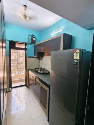 Kitchen in 2 BHK Apartment at Lalani Residency, Kavesar – for Rent