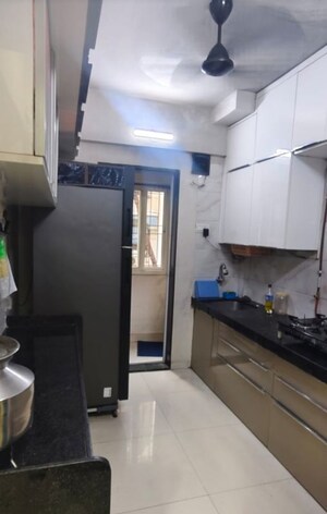 Kitchen in 2 BHK Apartment at Purnima CHS Naupada, Naupada – for Sale