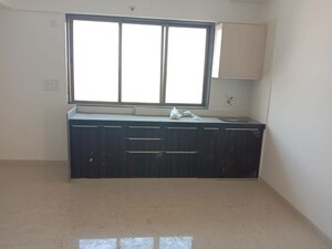 Kitchen in 2 BHK Apartment at Indu Ganesh CHS, Sion – for Sale