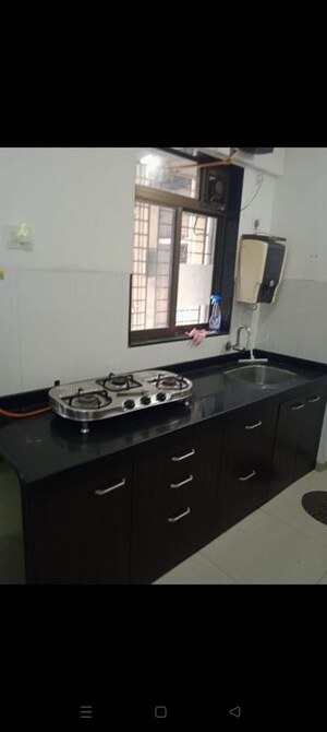 Kitchen in 2 BHK Apartment at Shree Satya Shankar Residency, Manpada – for Rent