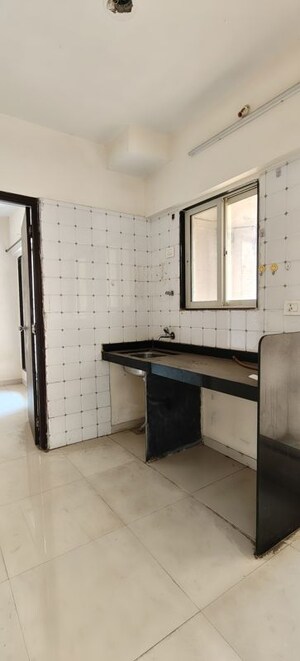 Kitchen in 1 BHK Apartment at Seven Apna Ghar Phase 2 Plot A, Mira Road – for Sale