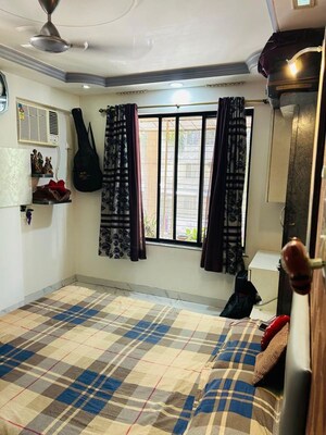 Living Room in 2 BHK Apartment at Sheth Vasant Sagar Complex, Kandivali East – for Rent