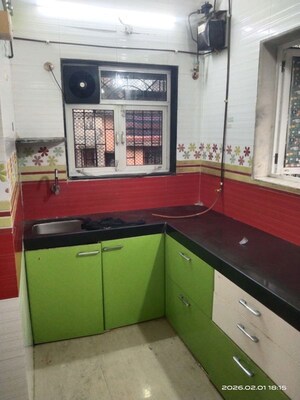 Kitchen in 1 BHK Apartment at Suryodaya Apartments, Seawoods Sector 48 – for Sale