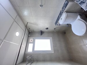 Bathroom in 3 BHK Apartment at Bhartiya Nikoo Homes Phase 2, Thanisandra Main Road – for Rent