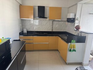 Kitchen in 2 BHK Apartment at Kolte Patil Langston, Kharadi – for Rent