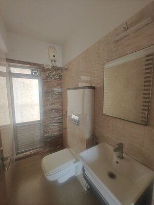Bathroom in 2 BHK Apartment at Rattan Icon, Seawoods Sector 50 – for Rent