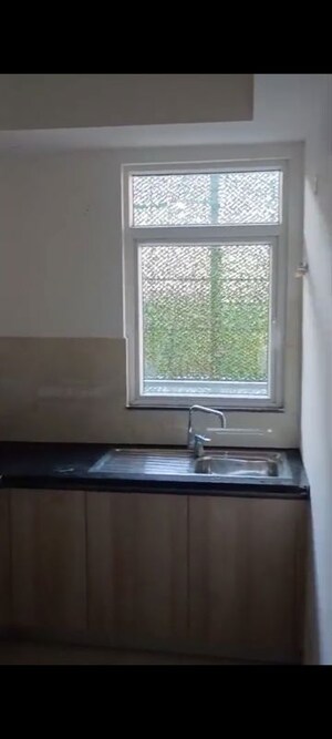 Kitchen in 2.5 BHK Apartment at Smart World Orchard, Sector 61 – for Rent