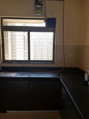 Kitchen in 1 BHK Apartment at Puranik City Reserva, Ghodbunder Road – for Rent