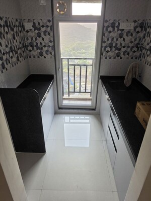 Team Area in 1 BHK Apartment at Paradigm Zenith Pushpanjali Residency Phase III, Ghodbunder Road – for Rent