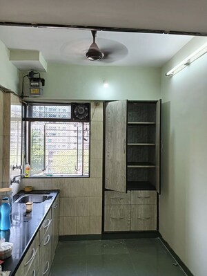Kitchen in 2 BHK Apartment at Dosti Group Maitri Gardens, Oswal Park – for Rent