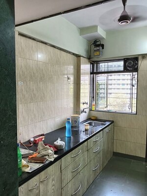 Kitchen in 2 BHK Apartment at Dosti Group Maitri Gardens, Oswal Park – for Rent