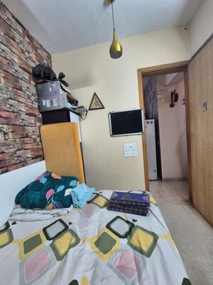 Bedroom in 2.5 BHK Apartment at The Wadhwa Palm Beach Residency, Nerul Sector 4 – for Sale