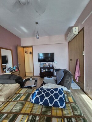 Living Room in 2.5 BHK Apartment at The Wadhwa Palm Beach Residency, Nerul Sector 4 – for Sale