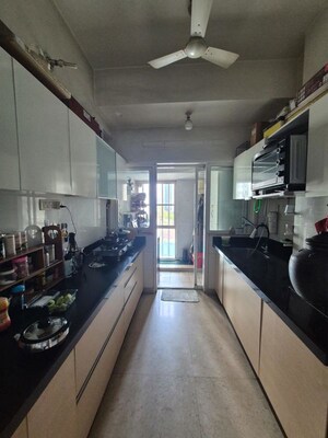 Kitchen in 2.5 BHK Apartment at The Wadhwa Palm Beach Residency, Nerul Sector 4 – for Sale