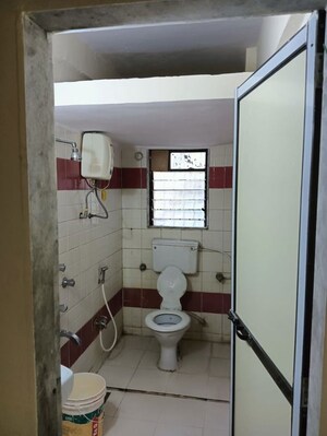 Bathroom in 2 BHK Apartment at Himgiri Lokupvan Phase II CHS Ltd, Vasant Vihar – for Rent