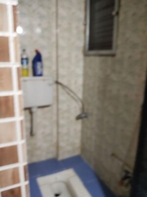 Bathroom in 1 BHK Apartment at Yashraj Park CHS, Kasarvadavali – for Rent