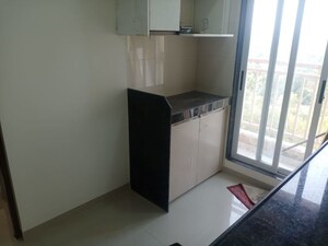 Kitchen in 1 BHK Apartment at Raunak Delight, Owale – for Rent