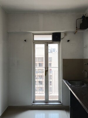 Kitchen in 1 BHK Apartment at Puranik Aarambh, Ghodbunder Road – for Rent