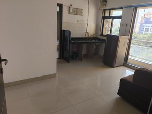 Living Room in 1 BHK Apartment at Haware Dahlia, Kasarvadavali – for Rent