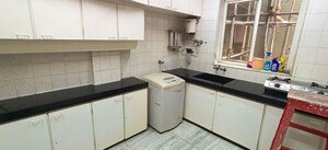 Kitchen in 1 BHK Apartment at Daulat Shirin CHS, Colaba – for Sale