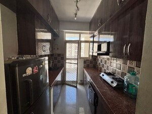 Kitchen in 3 BHK Apartment at Uninav Heights Phase I, Raj Nagar Extension – for Rent