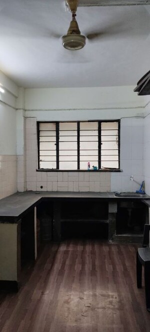 Kitchen in 2 BHK Apartment at Shri Krishna Nagar CHS, Erandwane – for Rent