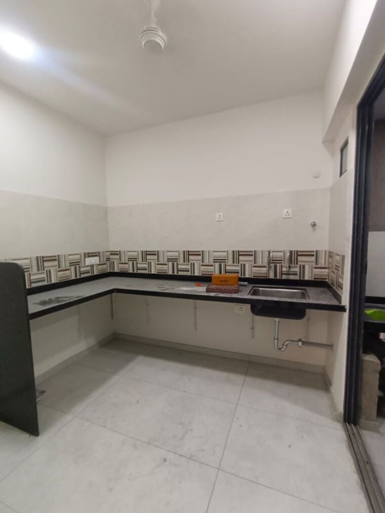 Kitchen, mantra-meraki 2 Bedroom 1100 Sq.Ft. Apartment In Akurdi Pune 10330272