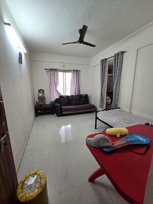 Living Room in 1 BHK Apartment at Gulmohor Imperial, Dhayari – for Sale