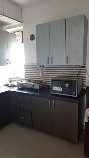 Kitchen in 2 BHK Apartment at Unitech Uniworld Resorts-The Residences, Sector 33 – for Rent