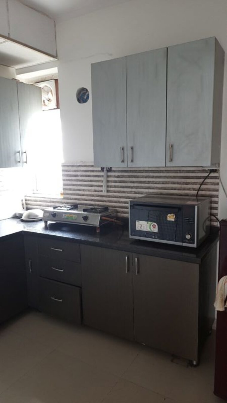 Kitchen, unitech-uniworld-resorts-the-residences 2 Bedroom 1125 Sq.Ft. Apartment In Sector 33 Gurgaon 10330875