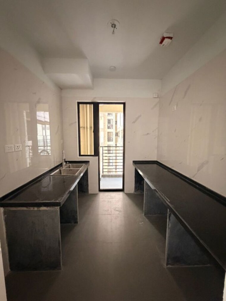 Kitchen, risland-the-icon 2 Bedroom 775 Sq.Ft. Apartment In Dhokali Thane 10331144