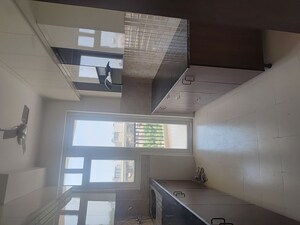 Kitchen in 3 BHK Apartment at Amrapali Eden Park, Sector 50 – for Sale