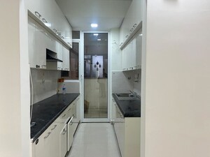 Kitchen in 2.5 BHK Apartment at Mahagun Mirabella Highrise, Sector 79 – for Rent