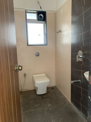 Bathroom in 2 BHK Apartment at Unique Abode, Kastur Park – for Rent