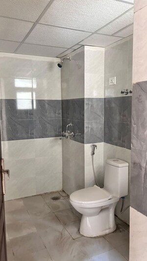 Bathroom in 2 BHK Apartment at Aims Greens Avenue, Sector 4 Greater Noida – for Rent