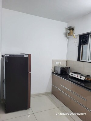 Kitchen in 2 BHK Apartment at Royal Orange County, Rahatani – for Rent