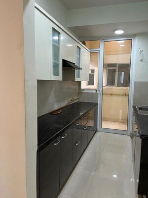 Kitchen in 2.5 BHK Apartment at Mahagun Mirabella, Sector 79 – for Rent