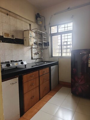 Kitchen in 1 BHK Apartment at Kanchan Pushp Society, Ghodbunder Road – for Rent